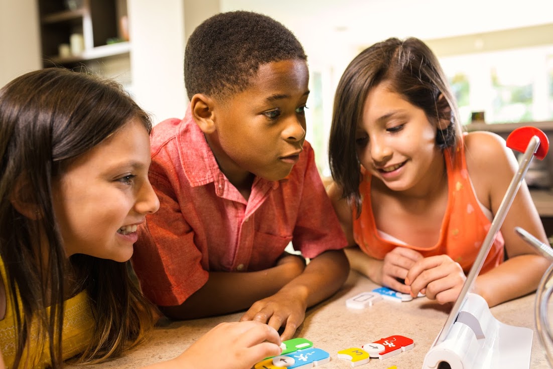Children playing an online and offline educational game from startup Osmo, which is being acquired by Indian developer Byju.