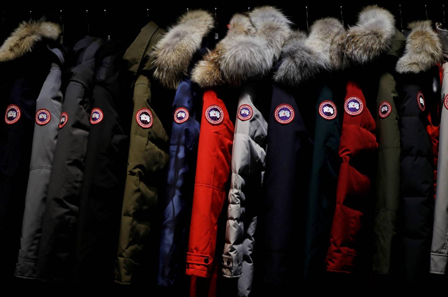 Jackets hang in the showroom of the Canada Goose factory in Toronto