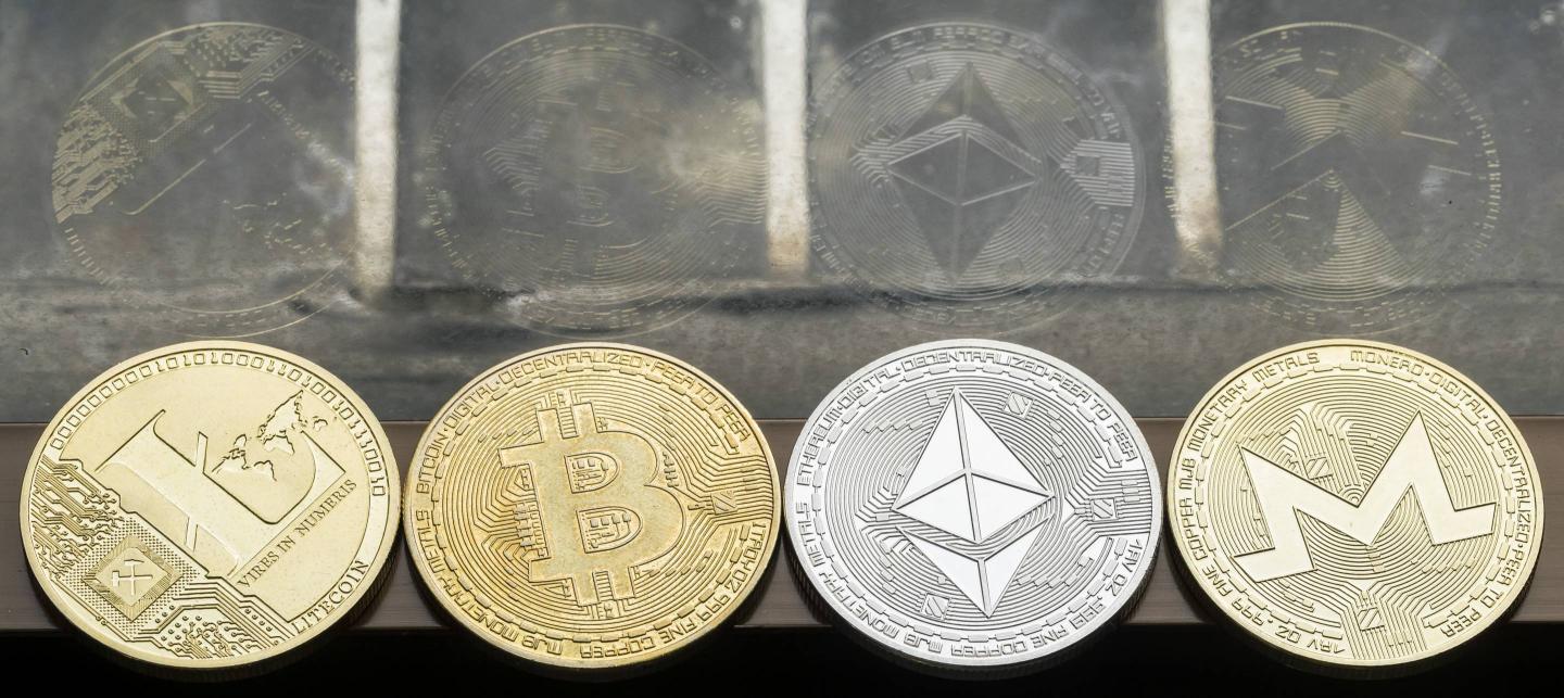 A photo illustration of cryptocurrencies.