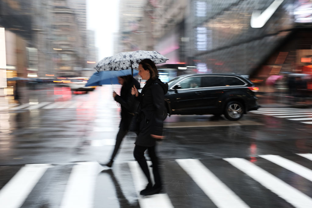 Cold Rain And Wind Bear Down On New York City Commuters