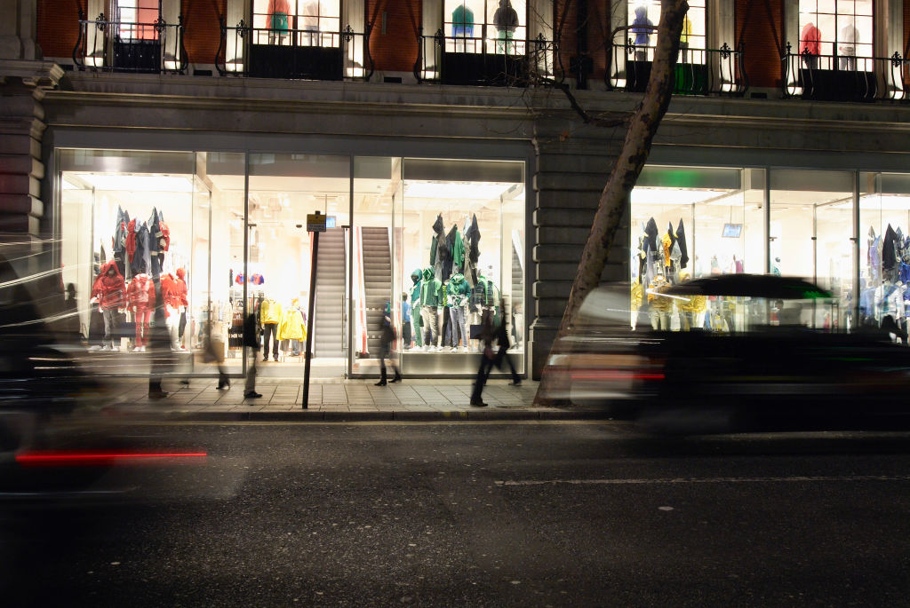Shop front at night, Oxford Street, London, UK