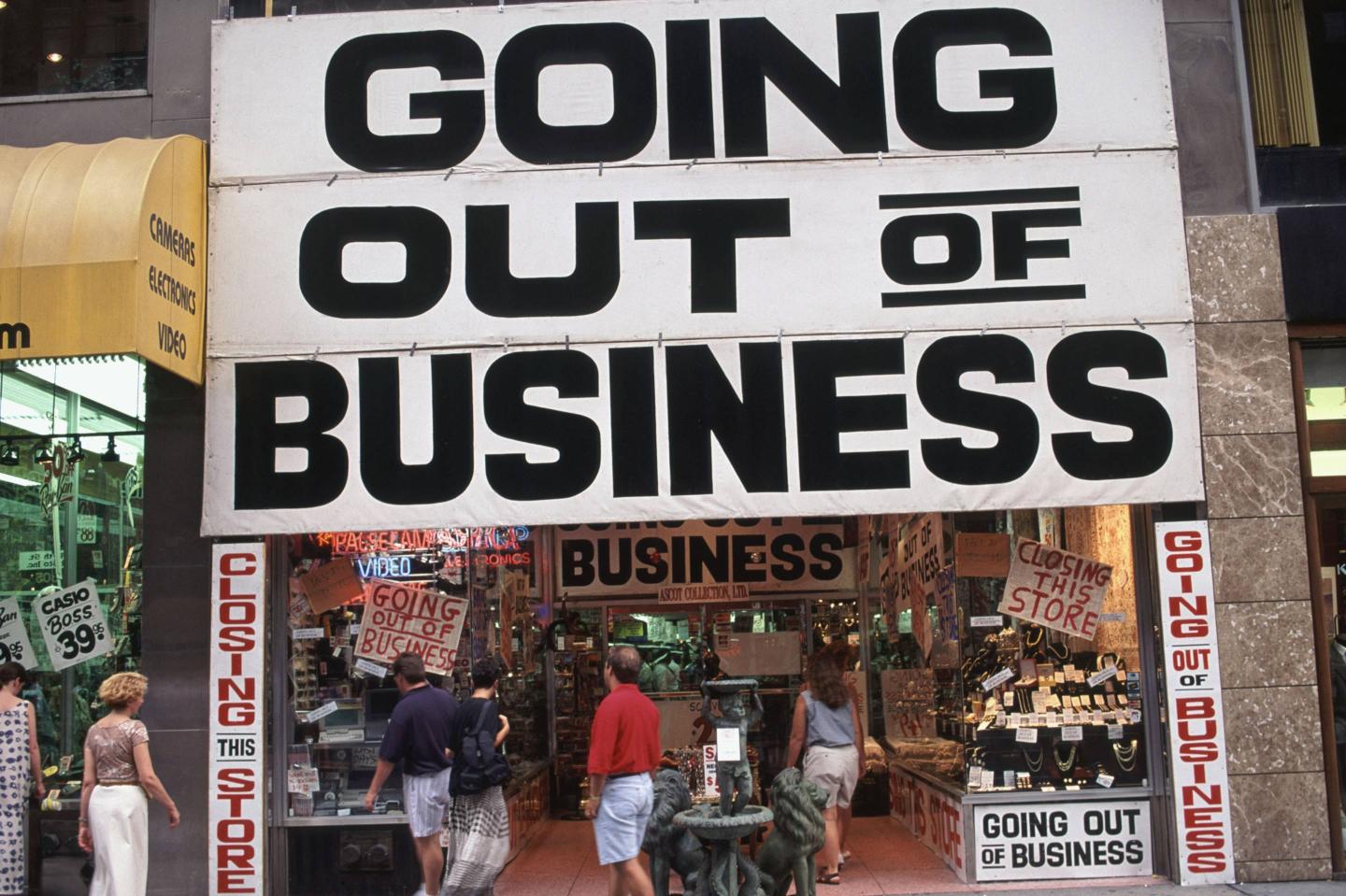 A store is going out of business on 5th Avenue in New York City.
