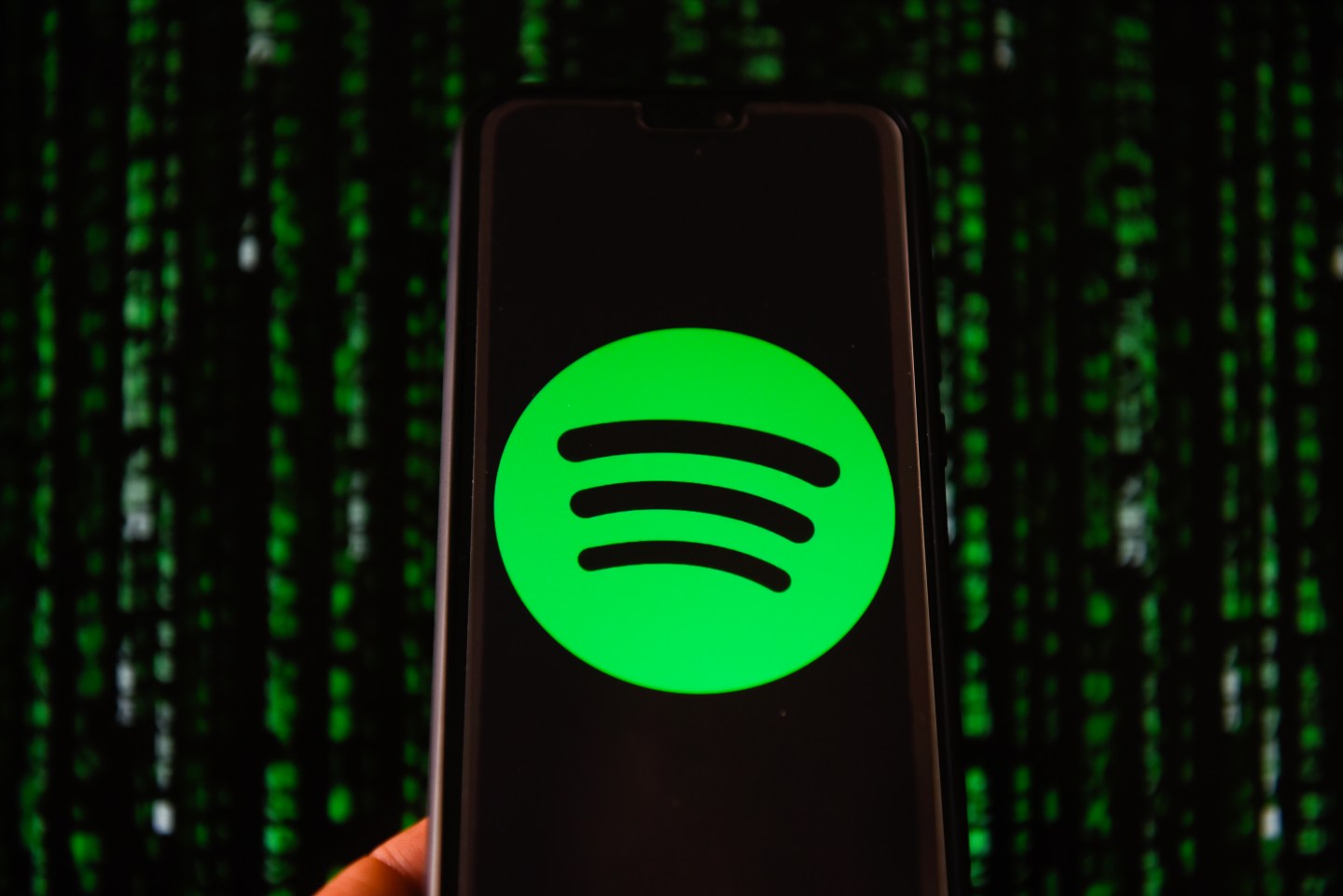 Spotify logo is seen on a mobile phone