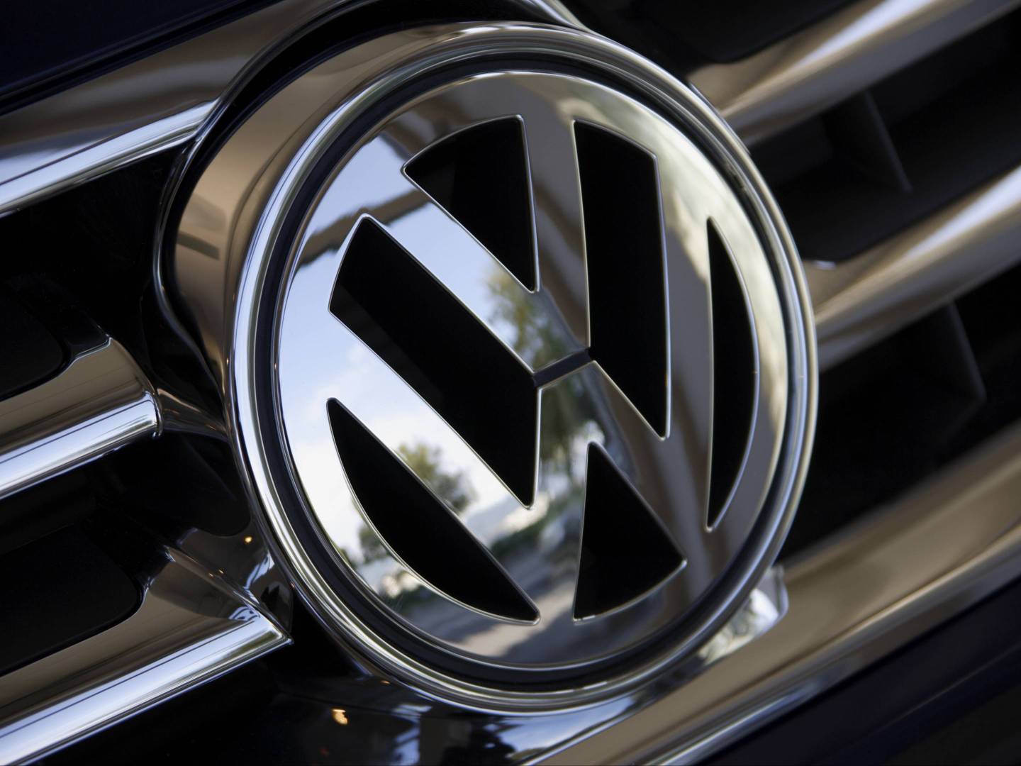 Close up of Volkswagen logo on car grill