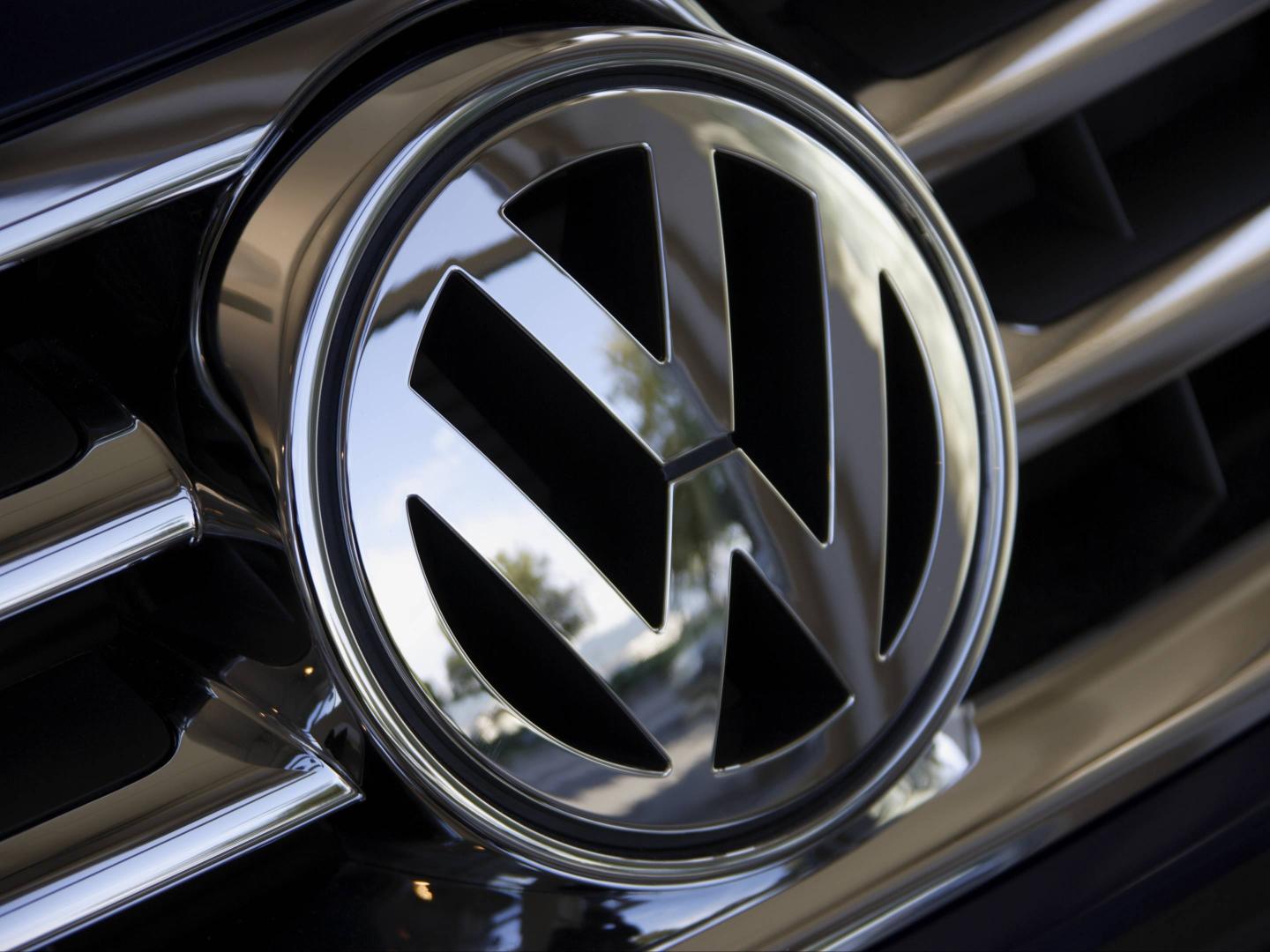 Close up of Volkswagen logo on car grill