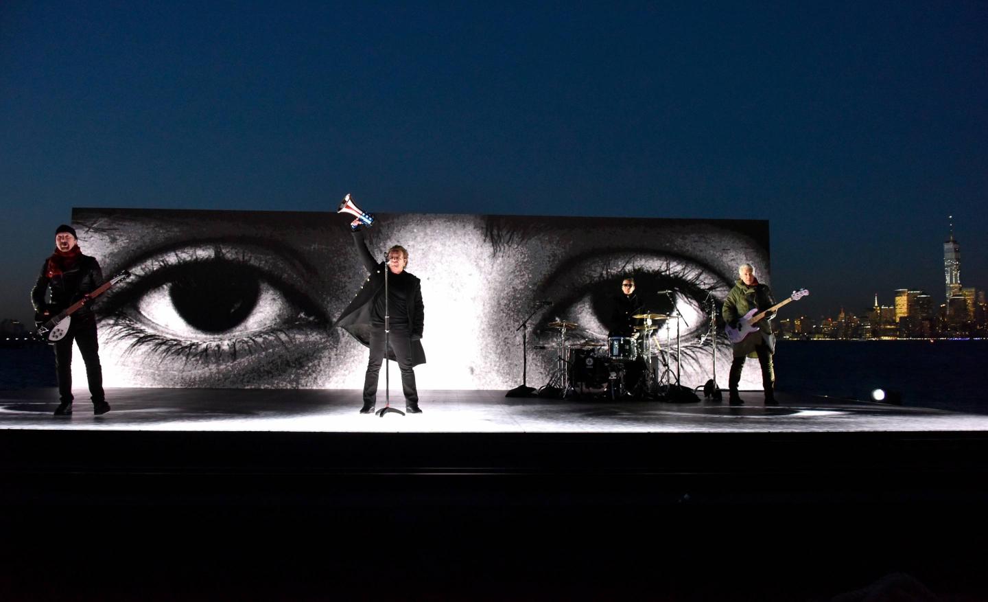 U2 makes a pro-immigration statement while performing on a barge during the 60th Annual Grammy Awards on Jan. 28, 2018, in New York City.