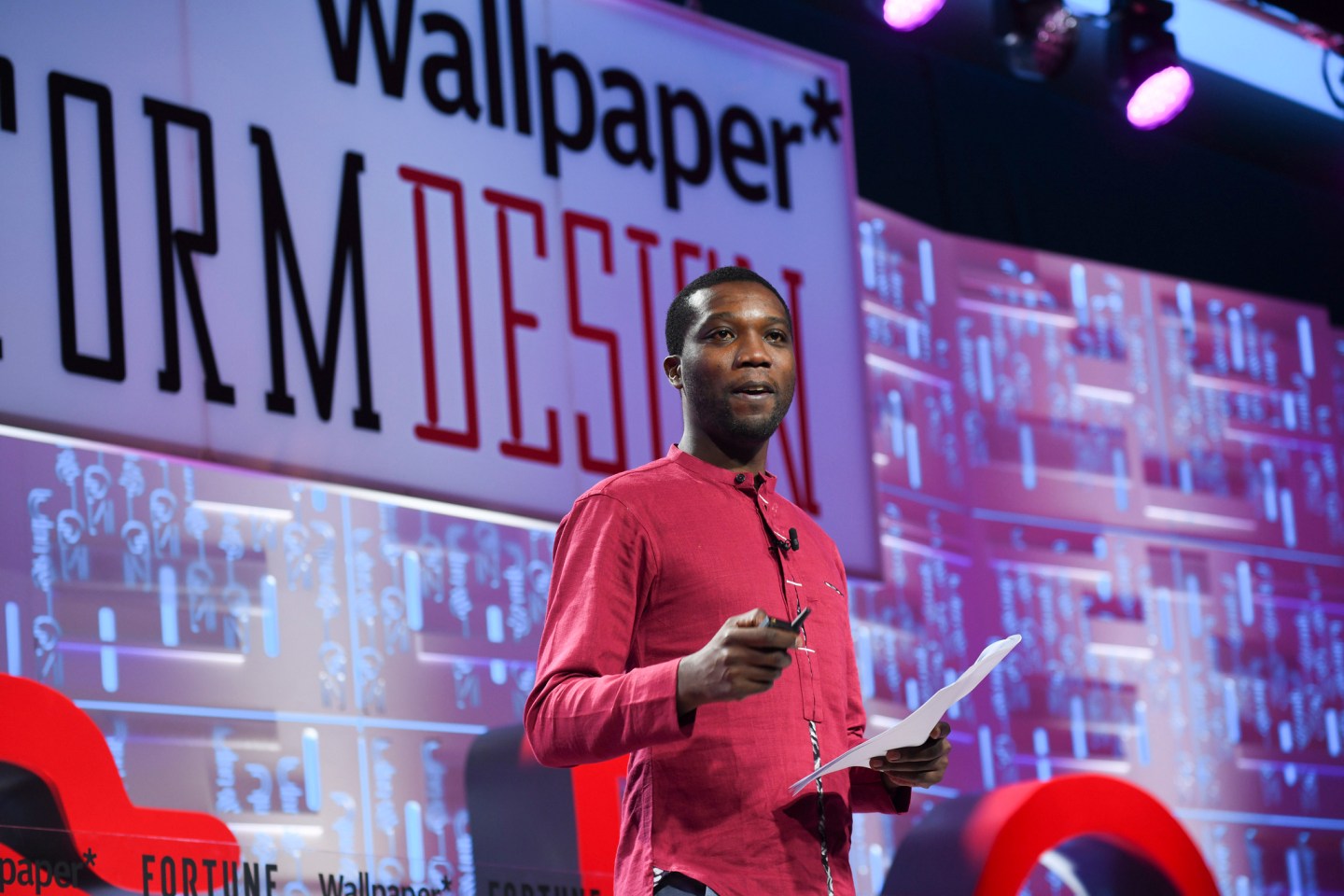 Architect Christian Benimana, principal of the MASS Design Group, speaking at the 2019 Fortune Brainstorm Design conference in Singapore.