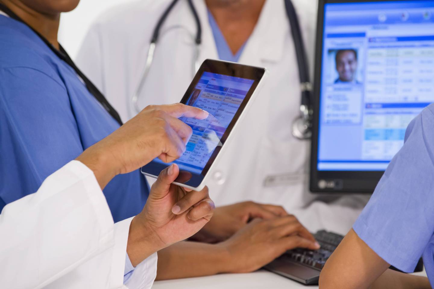 Doctors use a digital tablet.