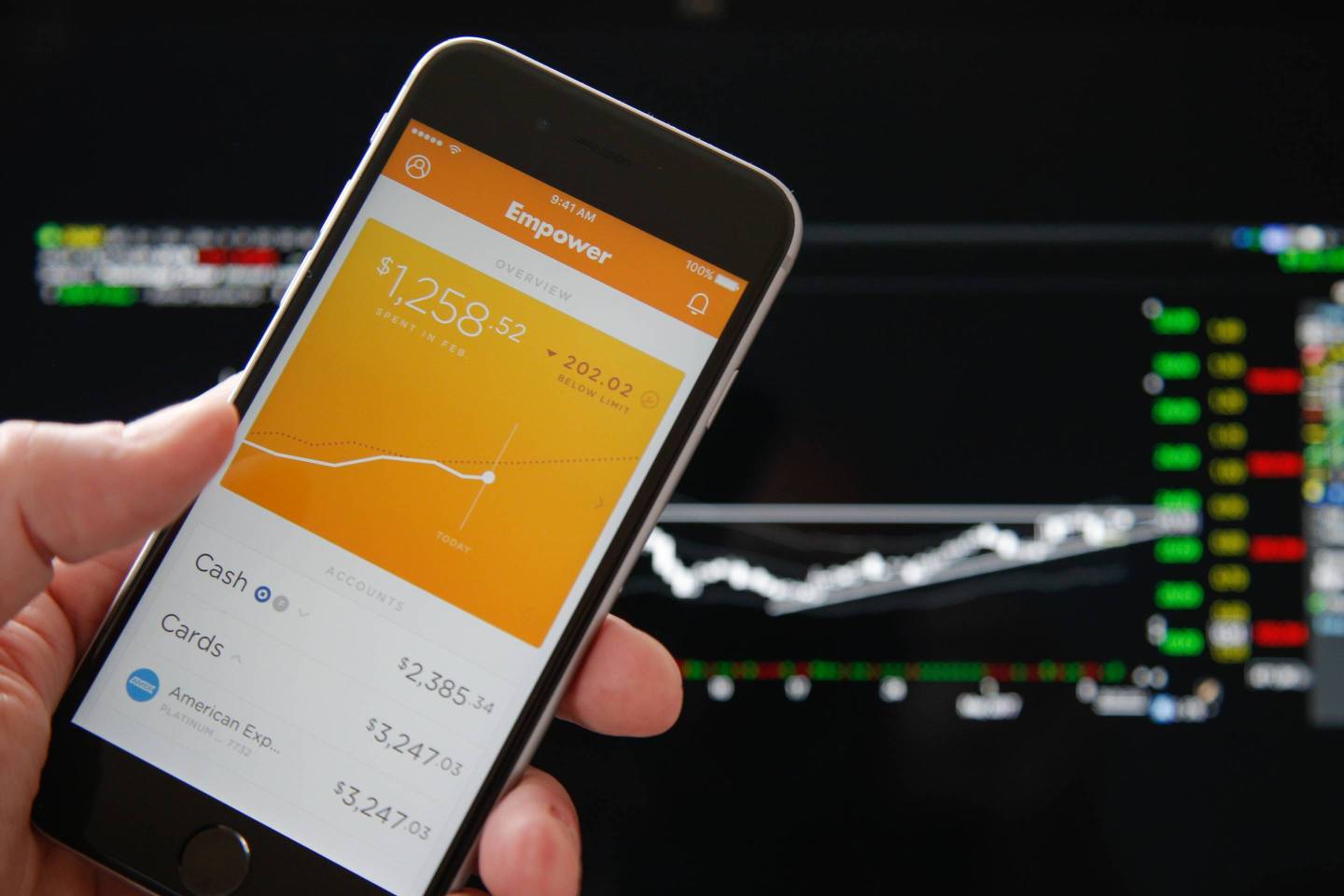 A woman is seen using the Empower app, an app developed to help millenials manage their finances and eventually to replace all banking apps.