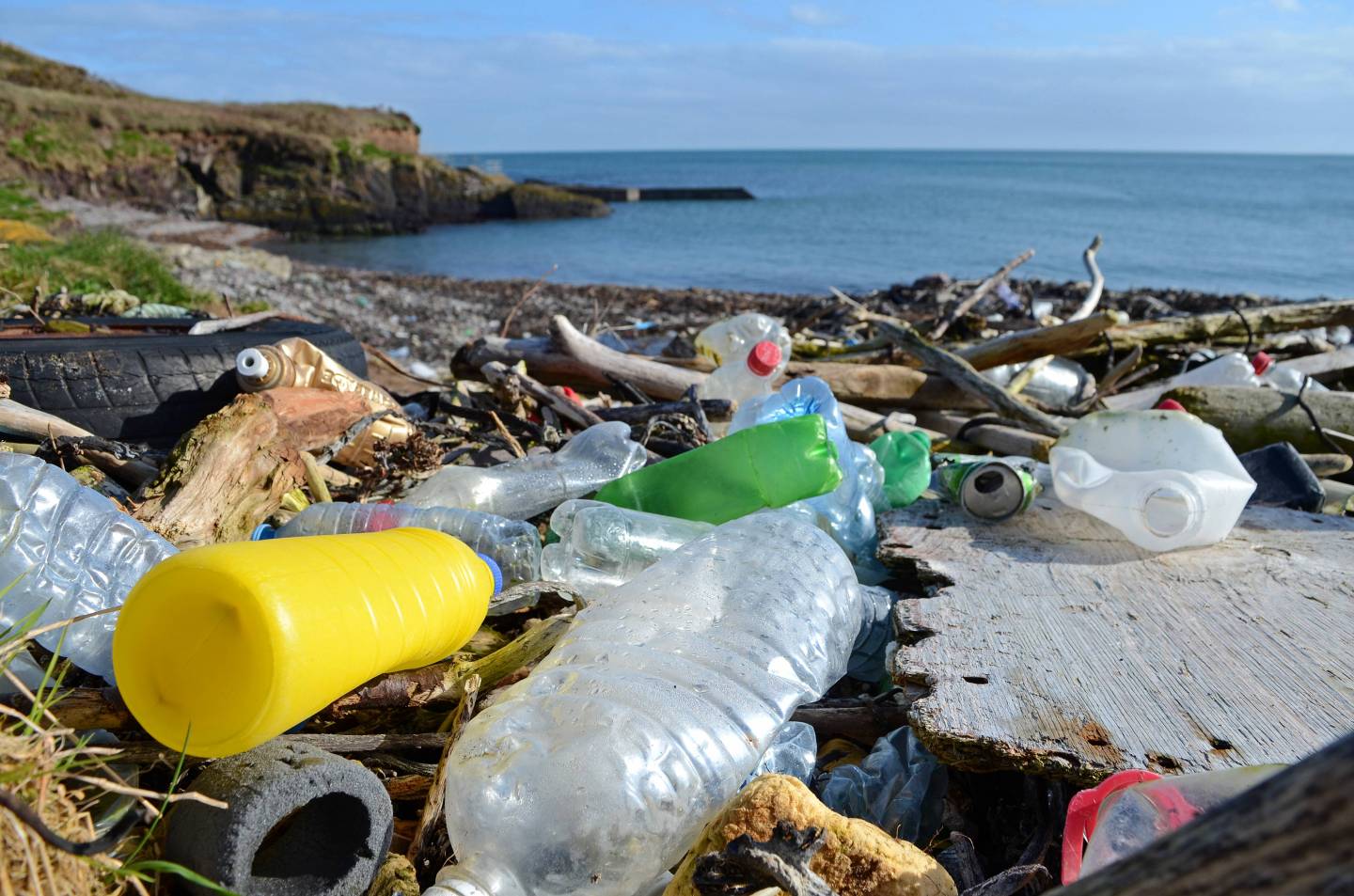 discarded plastic waste washed up on the beach at trabolgan on the southwest coast of Ireland