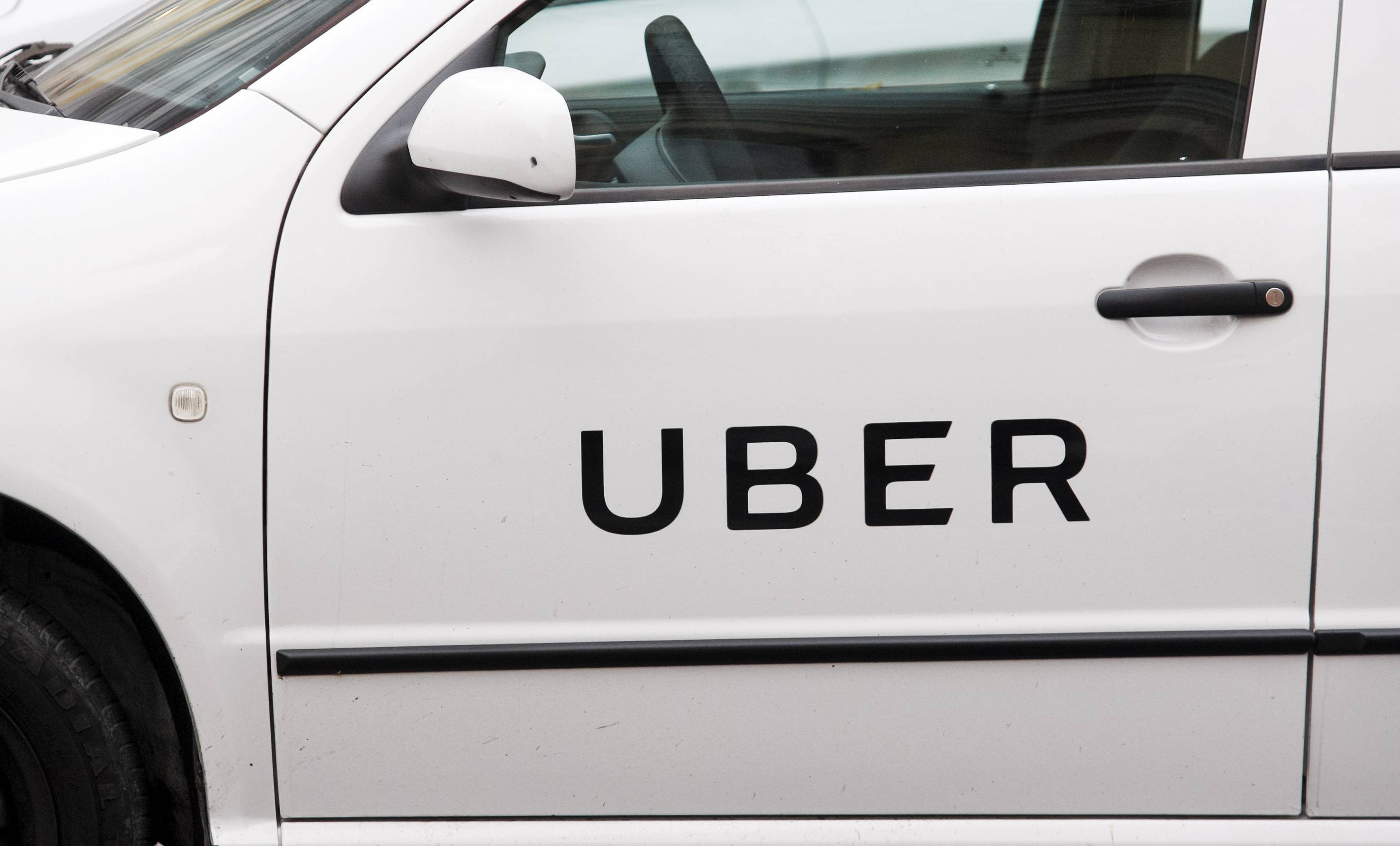 Uber logo on a car door