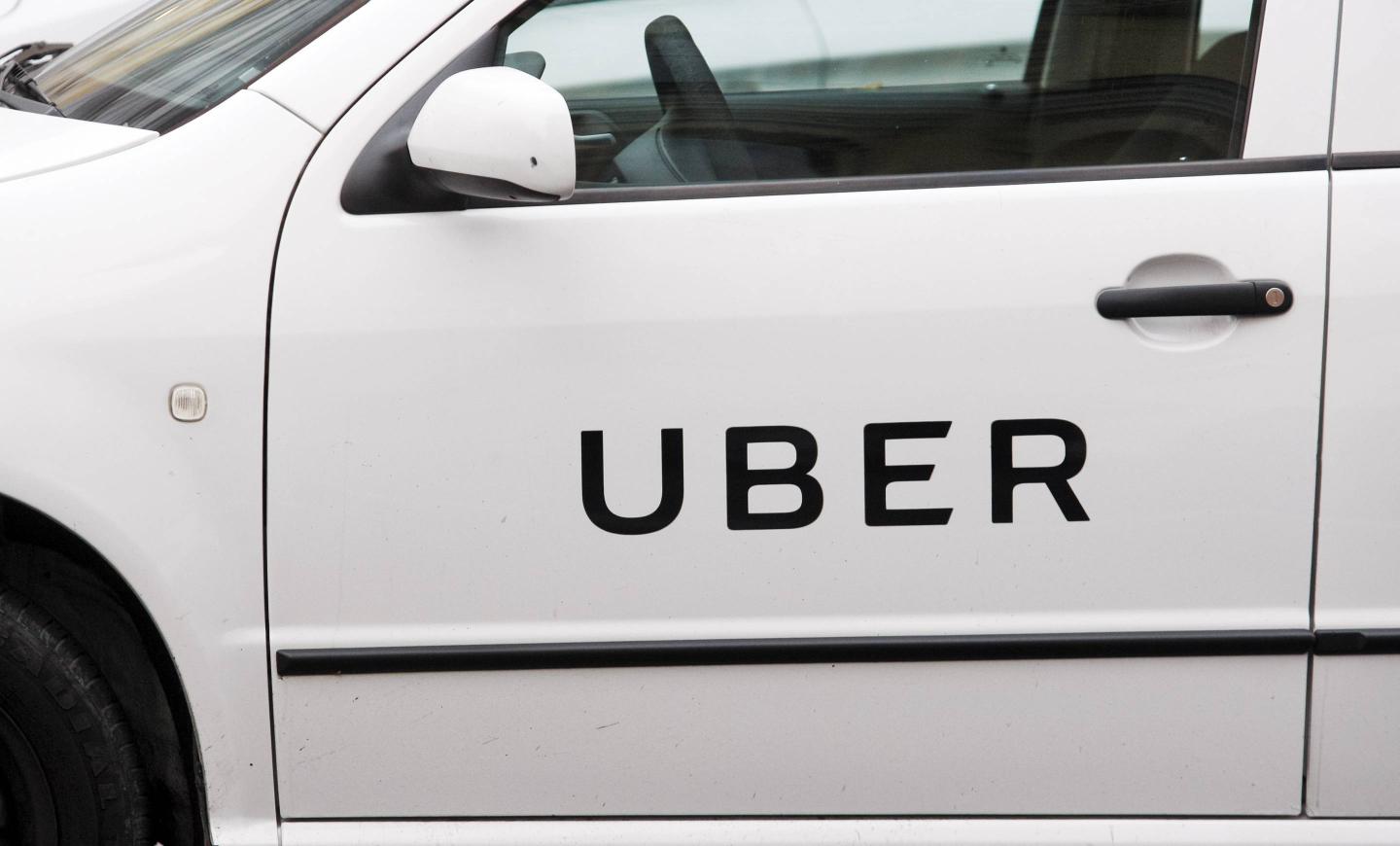 Uber logo on a car door