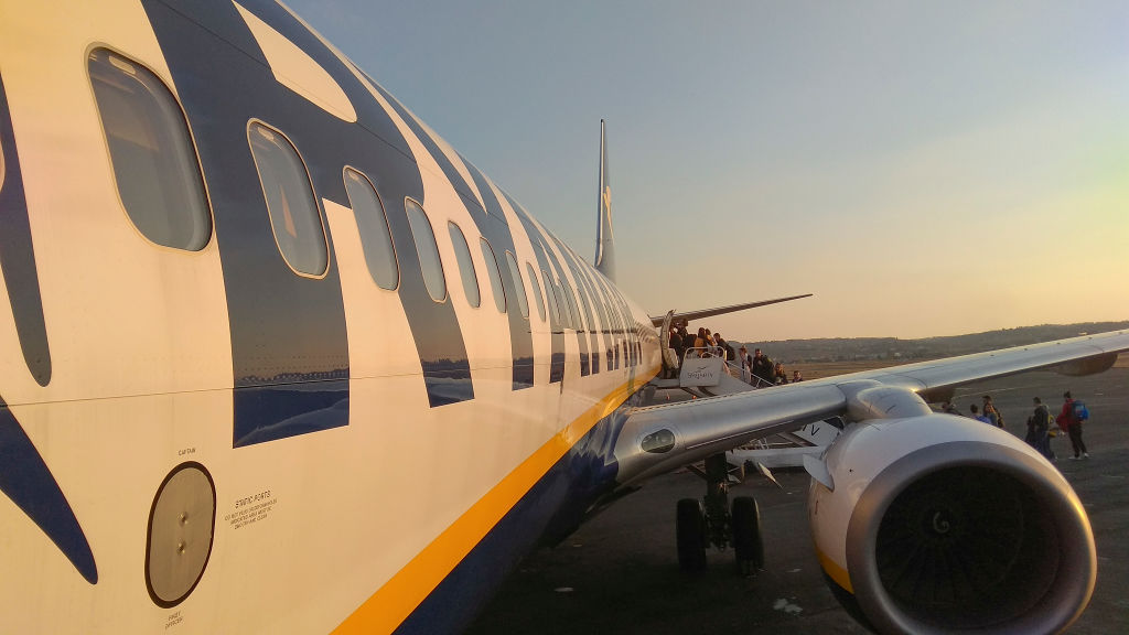 Passengers Boarding On Ryanair Airplane