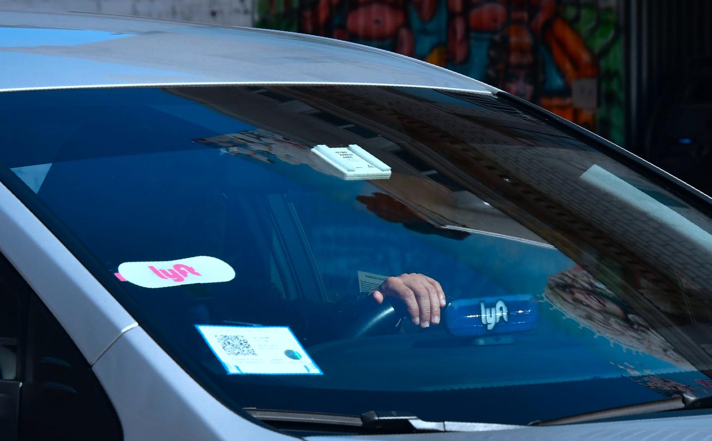 a lyft car drives by