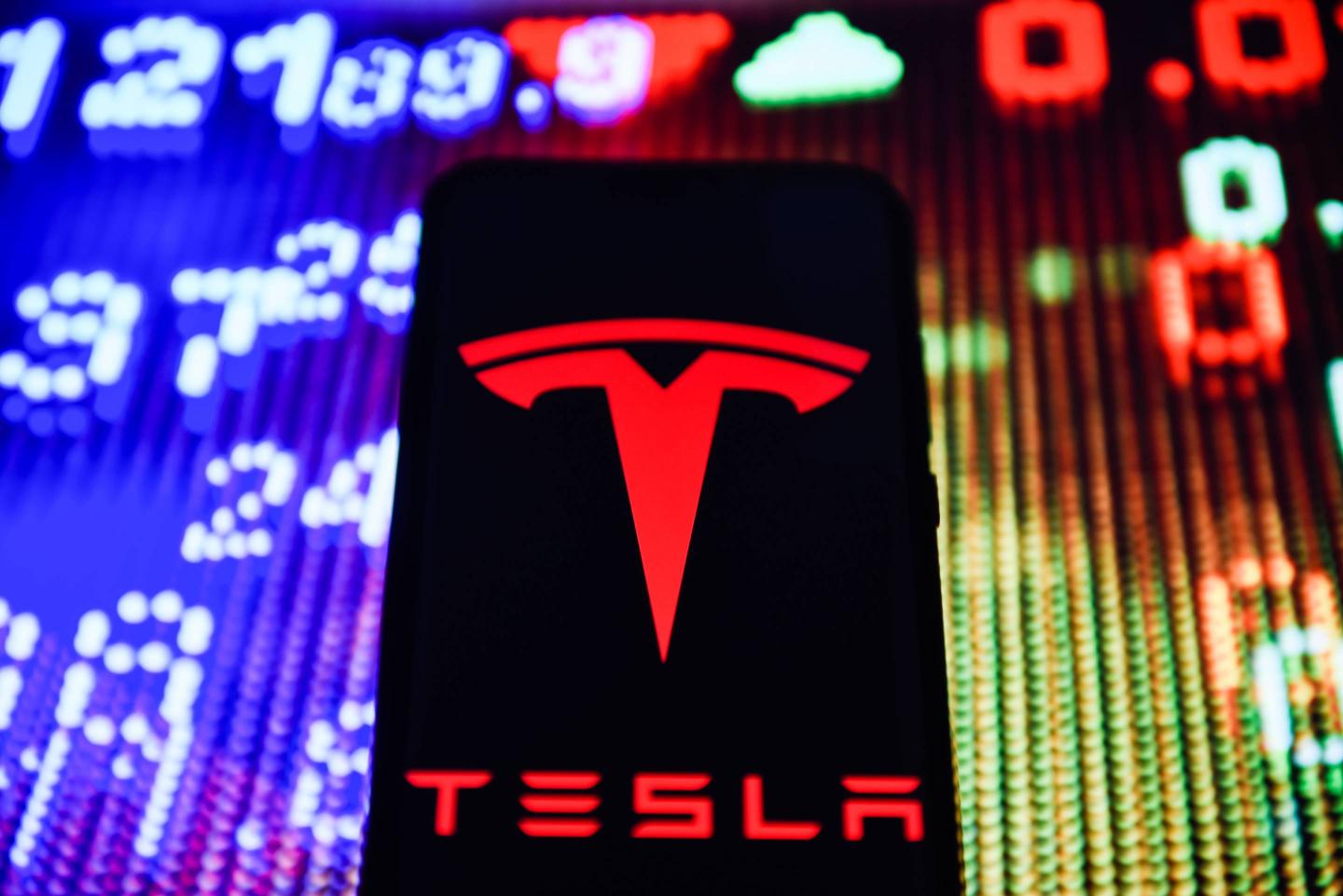 Tesla logo is seen on an android mobile phone