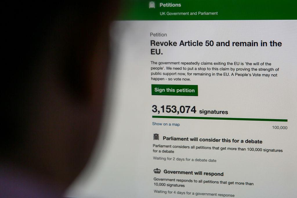 A woman in seen viewing the UK Government's Petition website