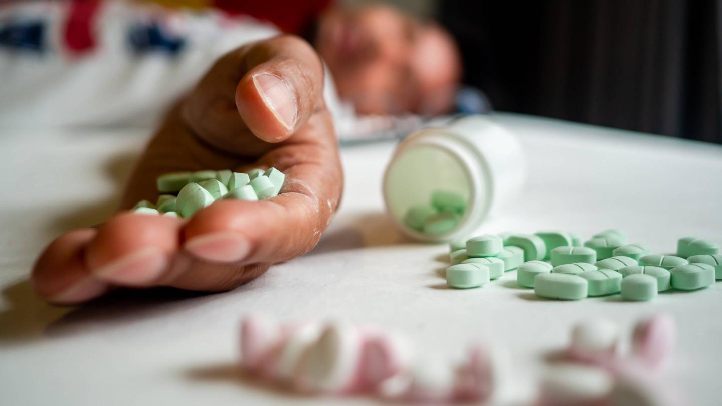 Dead Man With Medicines Lying On Floor