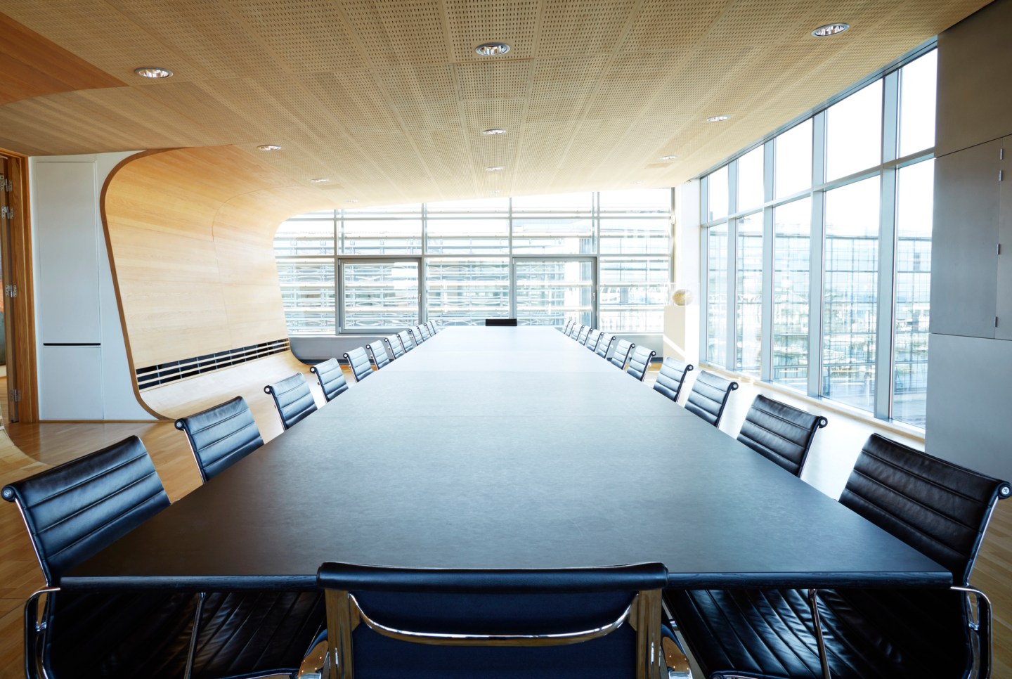View over huge table in designed meeting room