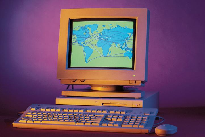Desktop computer with graphics displaying the world