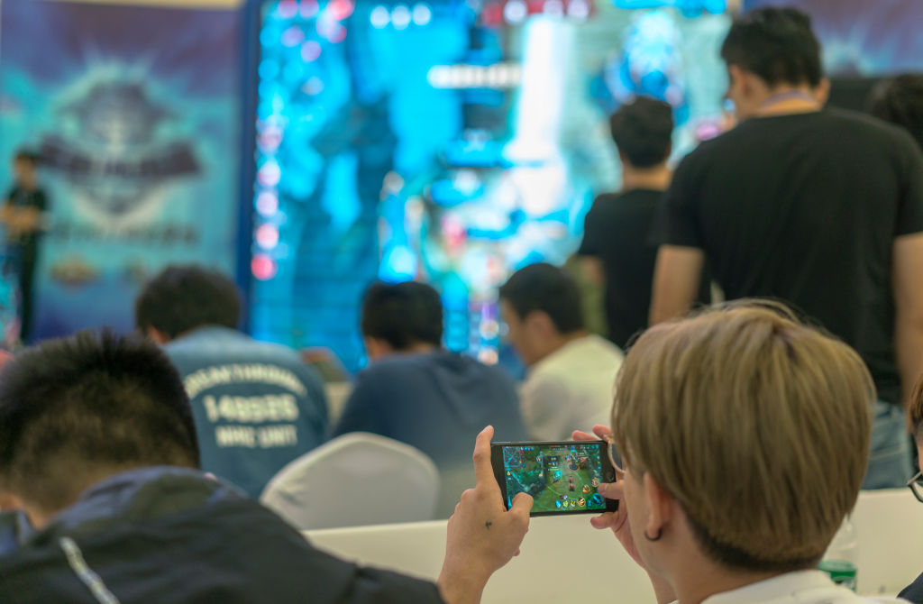 Young players compete in a battle match of the mobile game