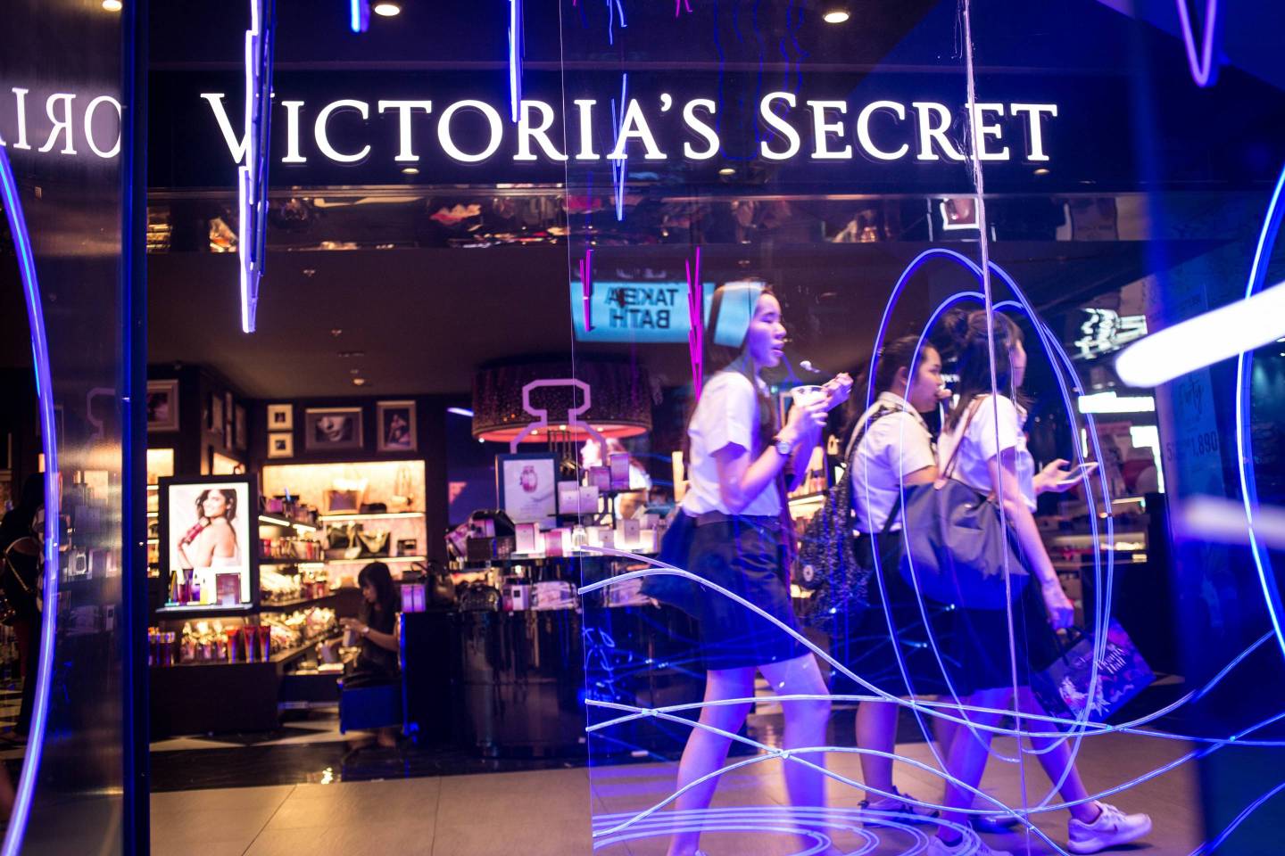 People walks past a Victoria's Secret store in Siam Center