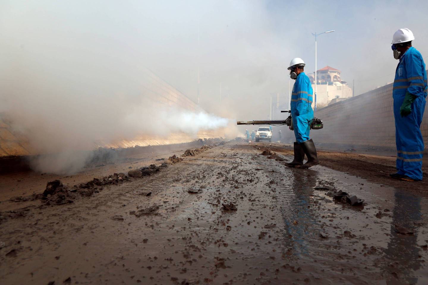 Yemeni officers combat the cholera epidemic in Sanaa on March 21, 2019.