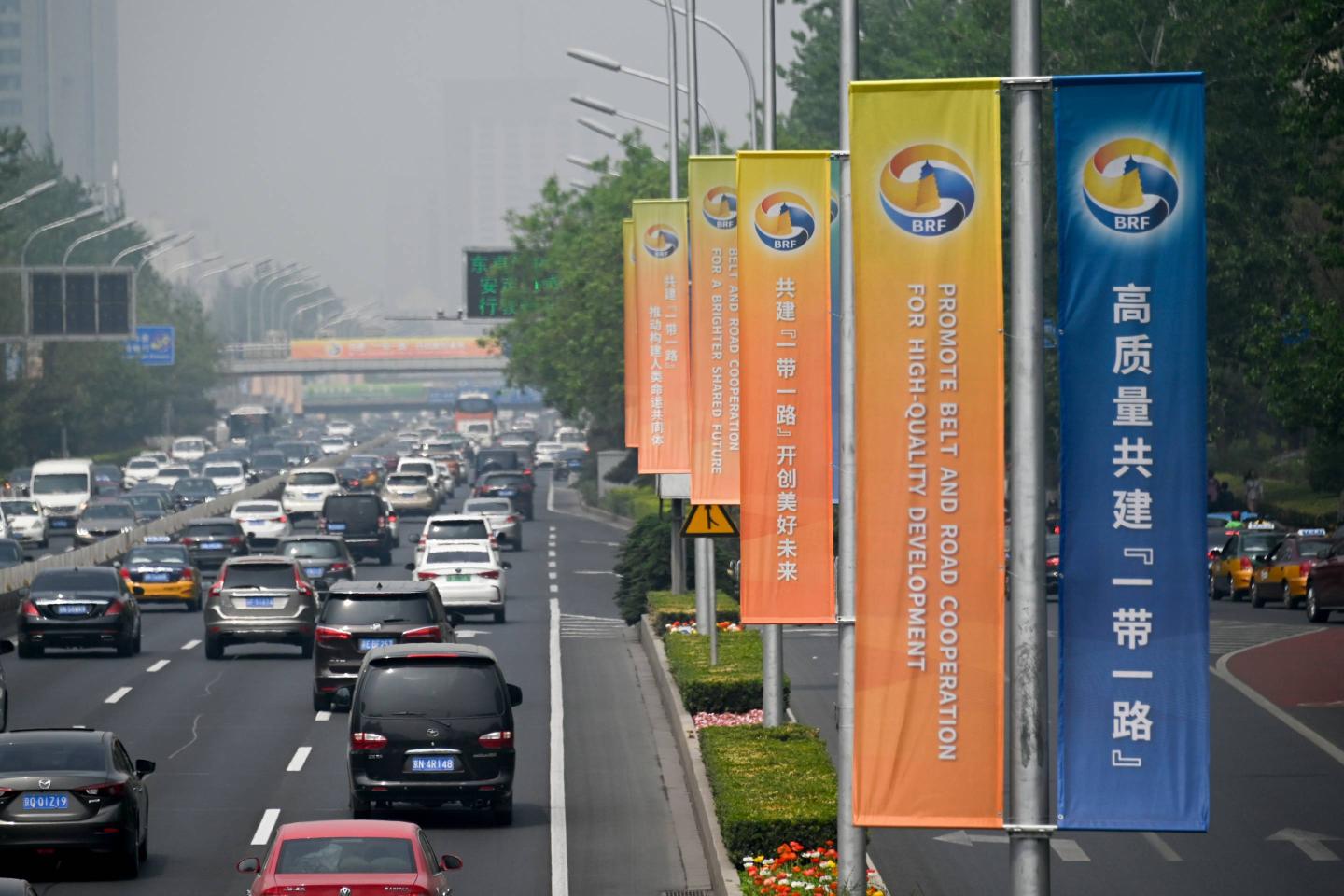 Banners are displayed along a street ahead of the Belt and Road Forum in Beijing on April 22, 2019.