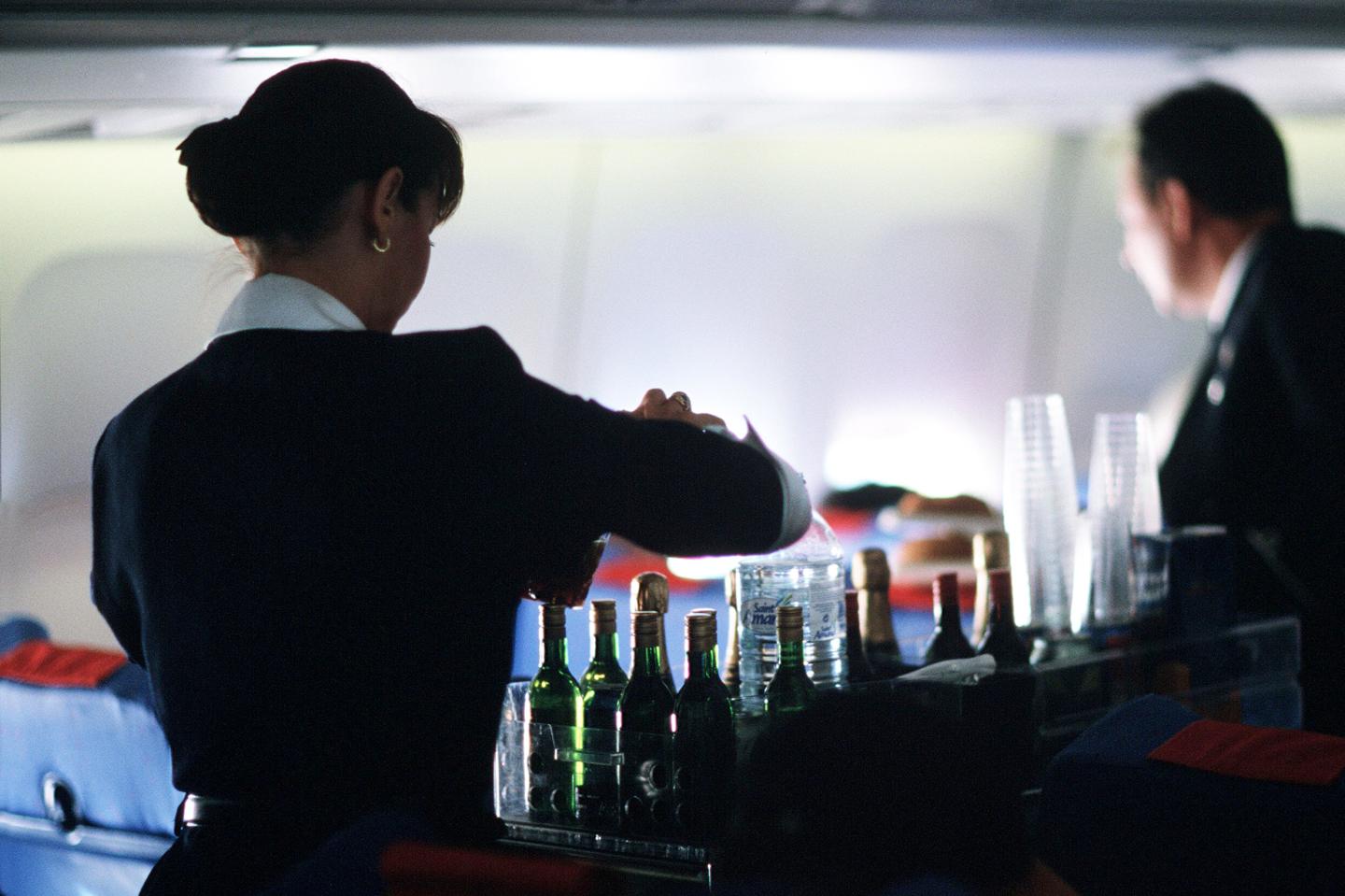 Flight Attendant serving drinks