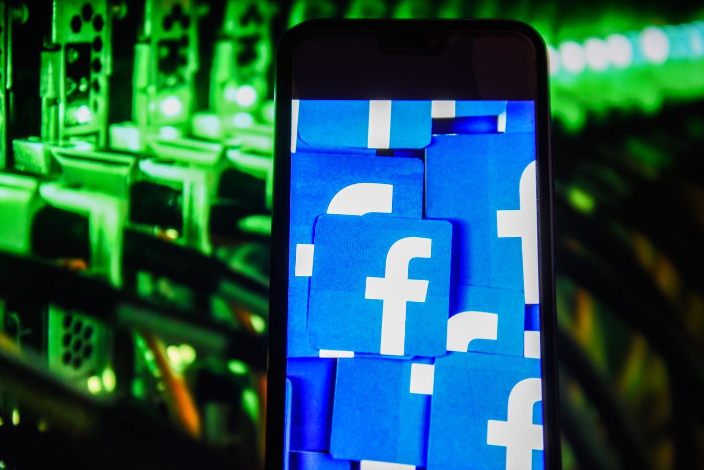 Facebook logo is seen on an android mobile phone