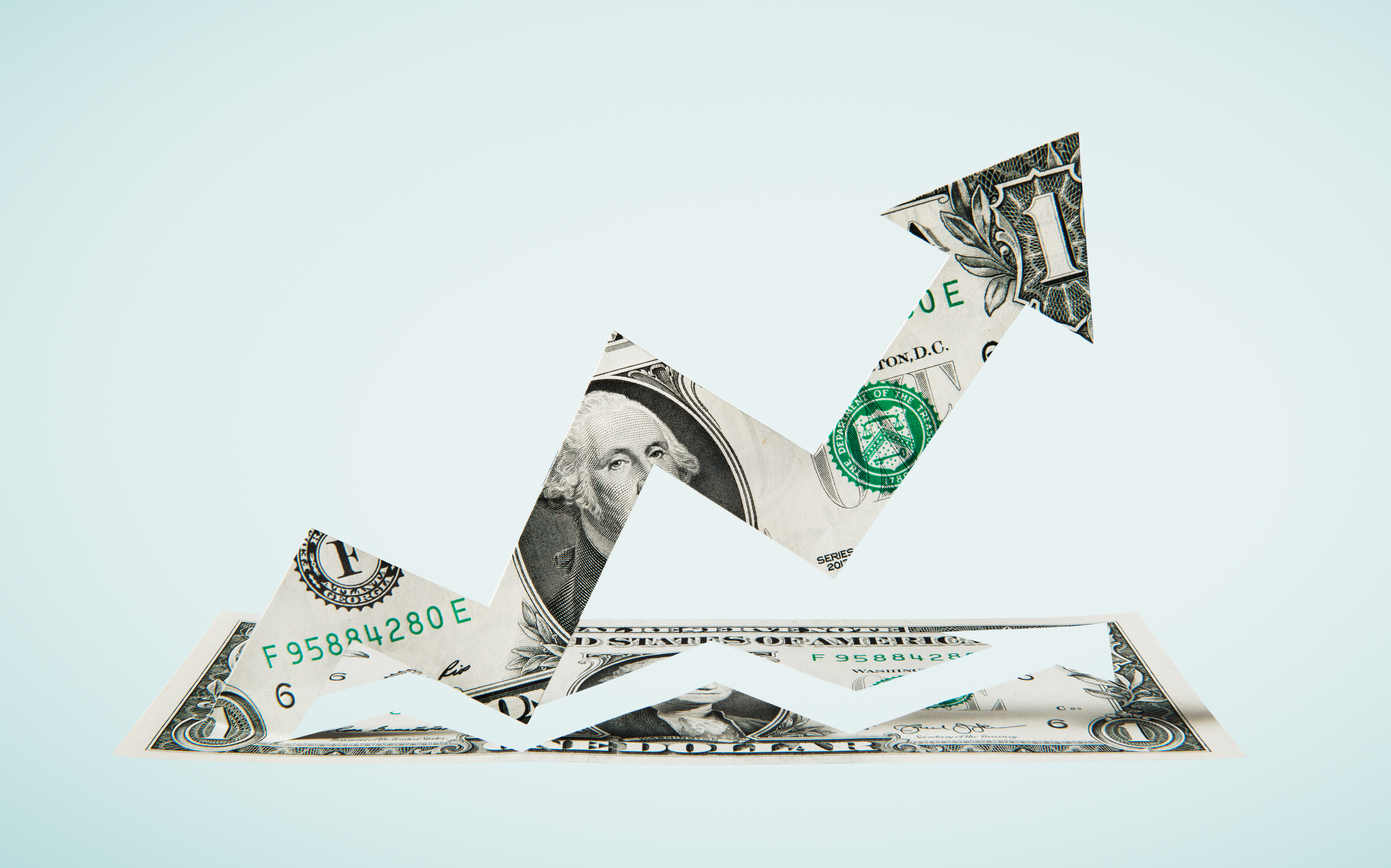 Paper-cut dollar - Upwards arrow.