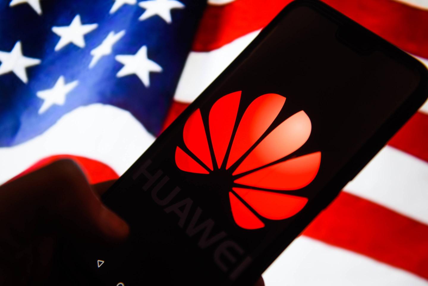Huawei  logo is seen on an android mobile phone with United