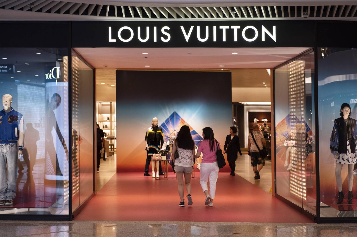 Customers are seen inside the French luxury fashion brand