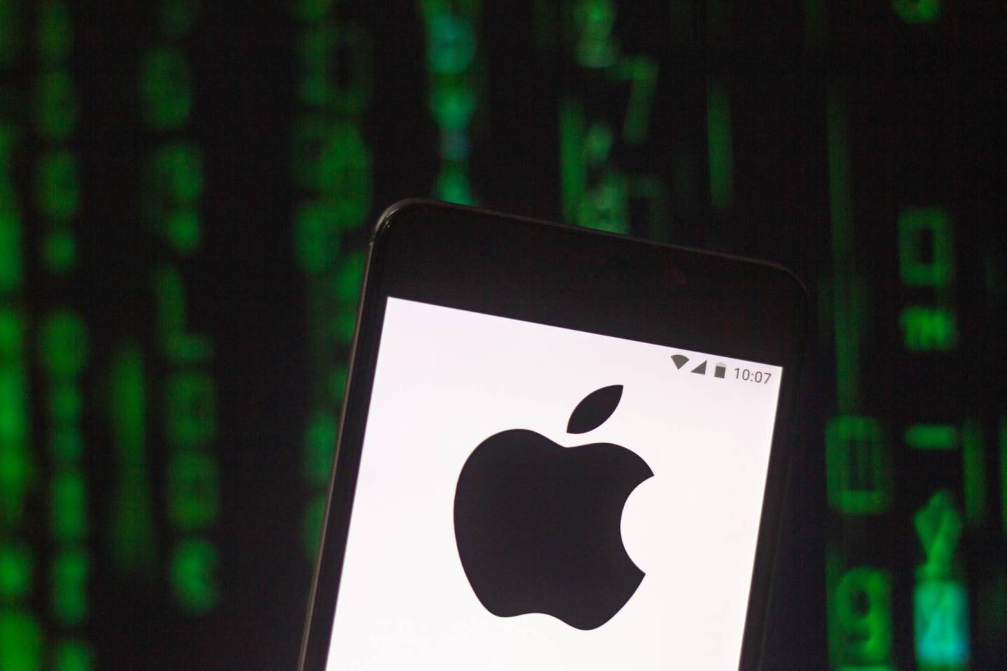 In this photo illustration the Apple logo seen displayed on