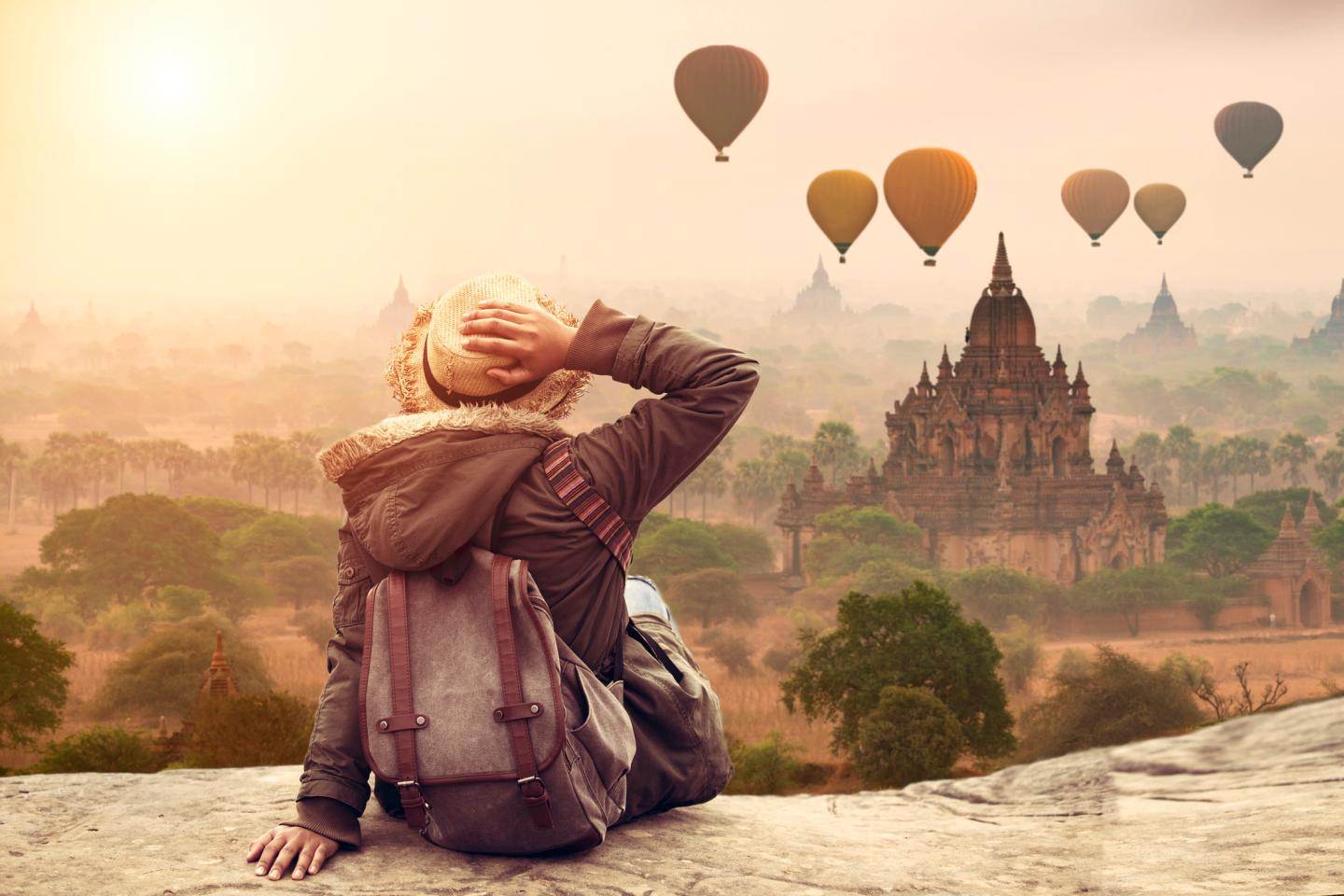 Myanmar, Young hipster woman traveller backpacker sitting watch Beautiful landscape Bagan Mandalay ancient pagoda in Bagan, Mandalay Myanmar.