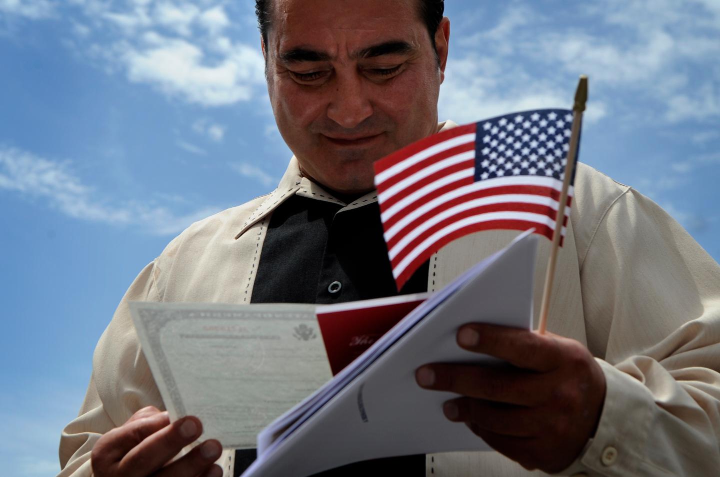 (XX)WRESTLER_062308_CFW- Tsolak Yeghishyan admires his Certificate of Naturalization after his naturalization ceremony at the United States Citizenship & Immigration Services building in Denver, CO. Tsolak Yeghishyan was an Olympic wrestler for Armenia in