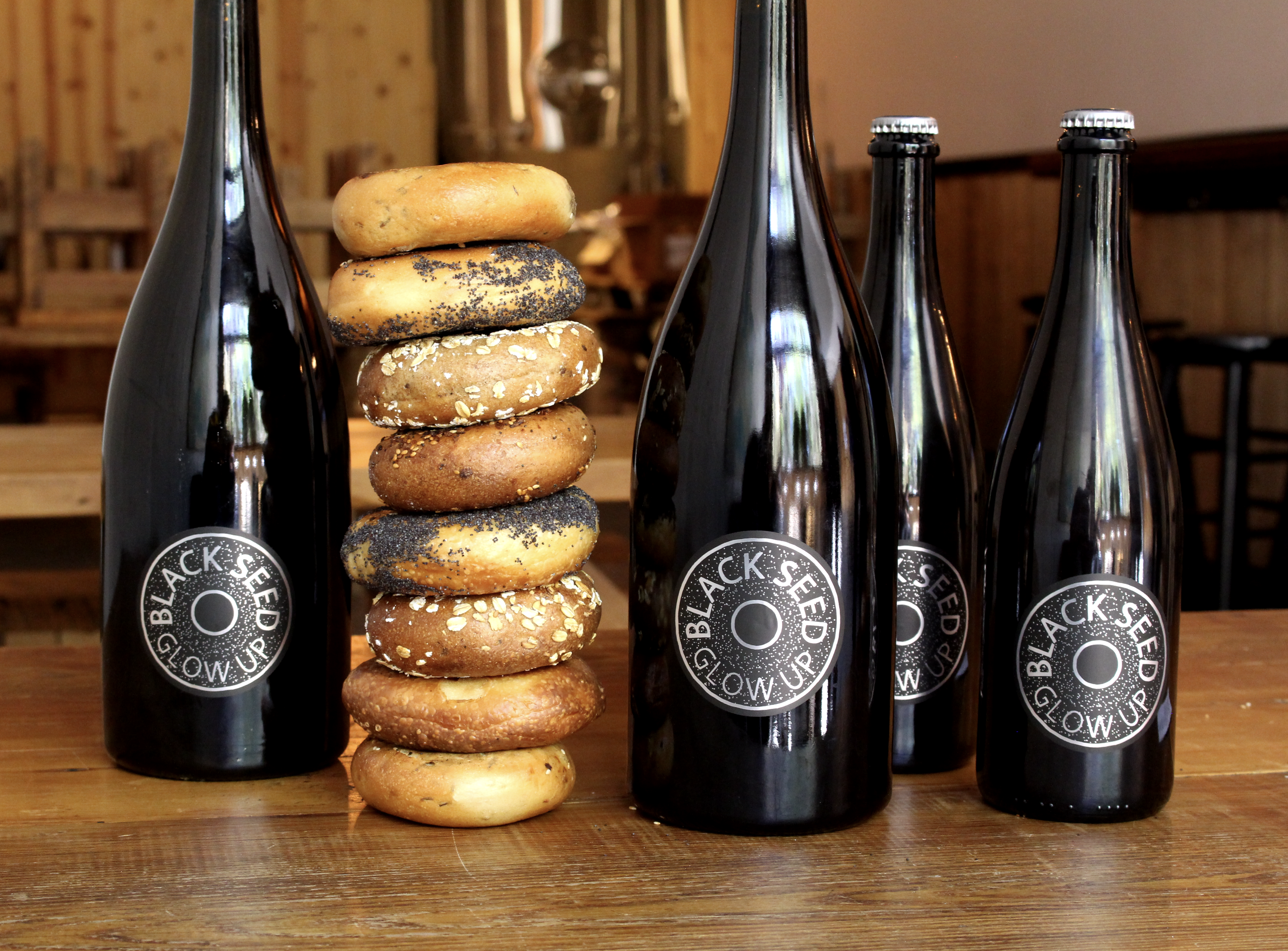 Two Brooklyn-based businesses have partnered to create Black Seed Glow Up, a limited-release beer brewed by Folksbier using Black Seed's leftover bagels. 