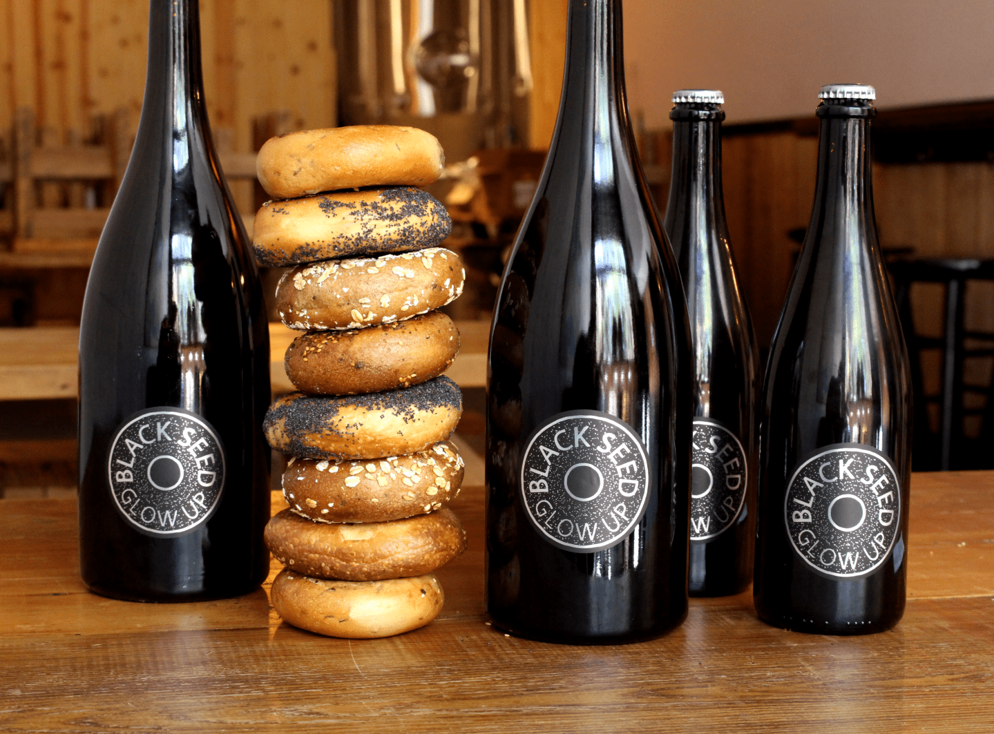 Two Brooklyn-based businesses have partnered to create Black Seed Glow Up, a limited-release beer brewed by Folksbier using Black Seed's leftover bagels. 