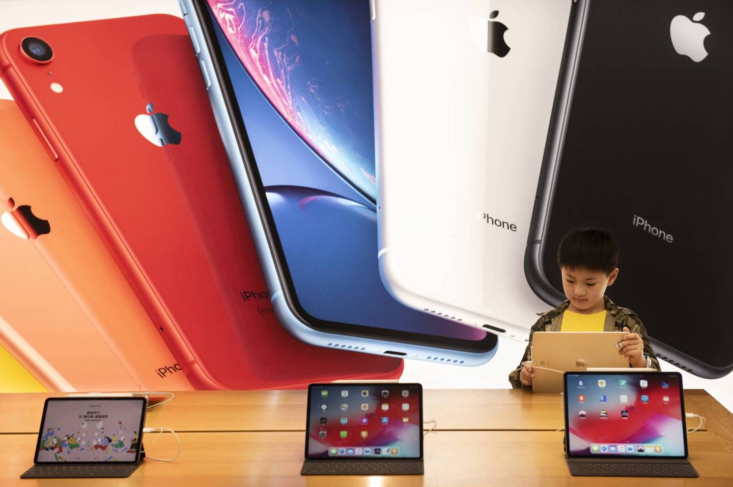 A child seen with a ipad at an American multinational