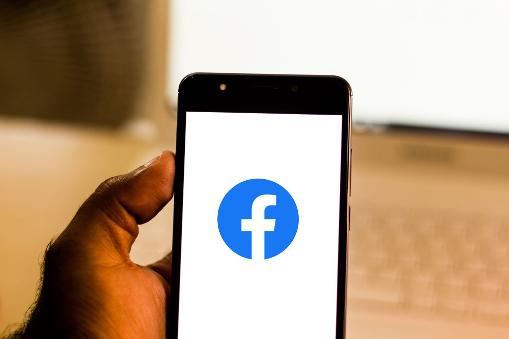 In this photo illustration the Facebook logo is seen