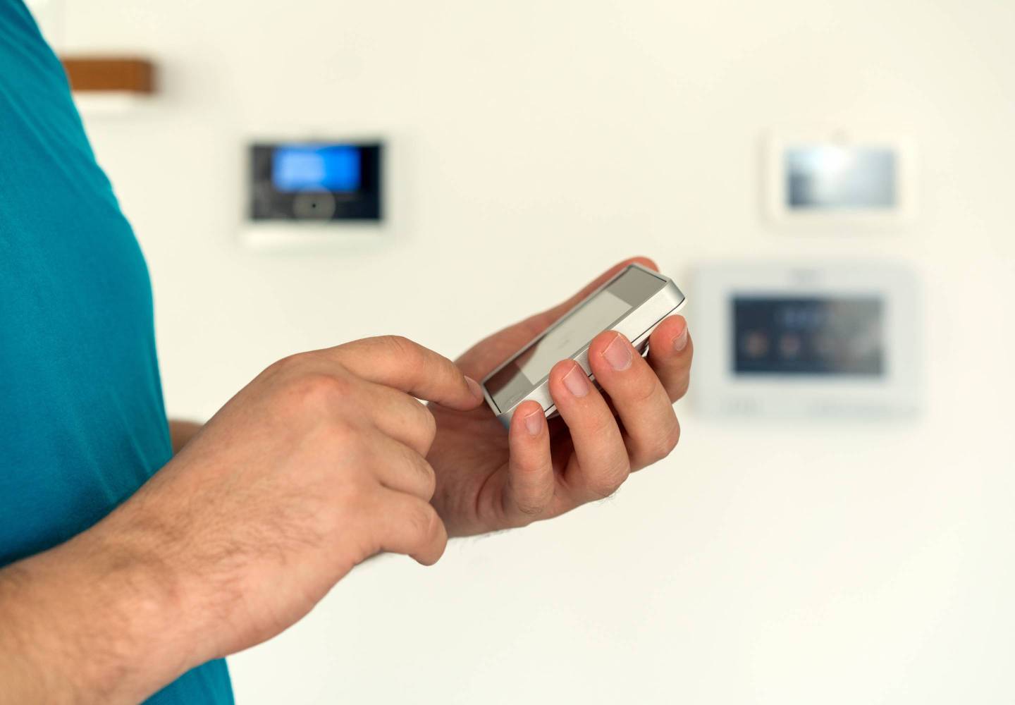 Man using digital device high tech touch screen for smart home functions