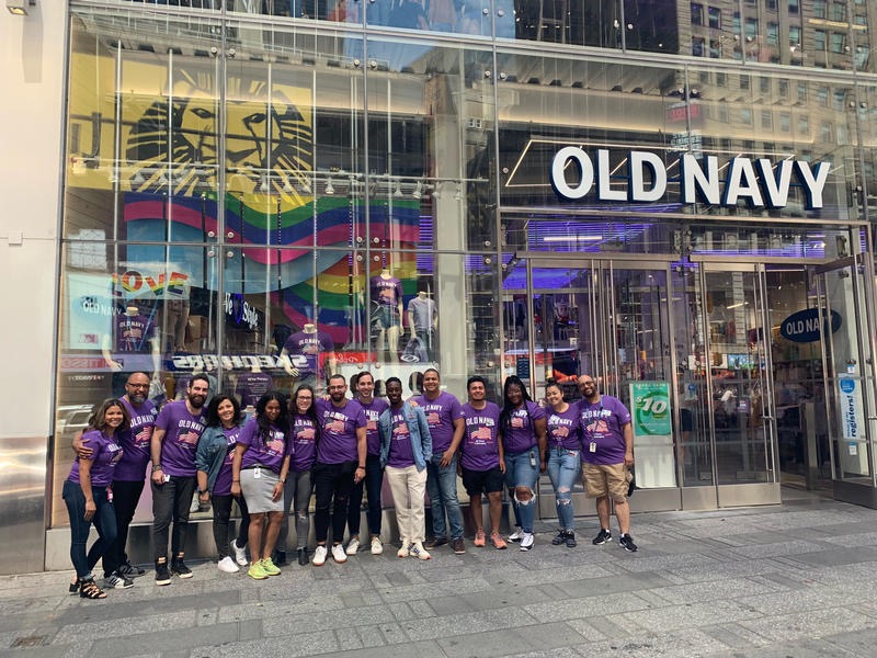 Old Navy employees in front of a store in Times Square in New York City.