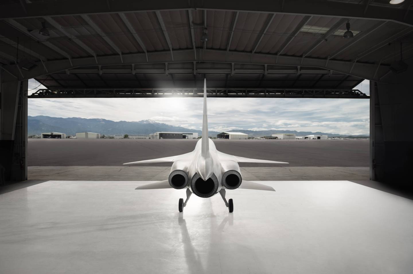 A computer-generated image of the Boom Supersonic XB1 leaving its hangar