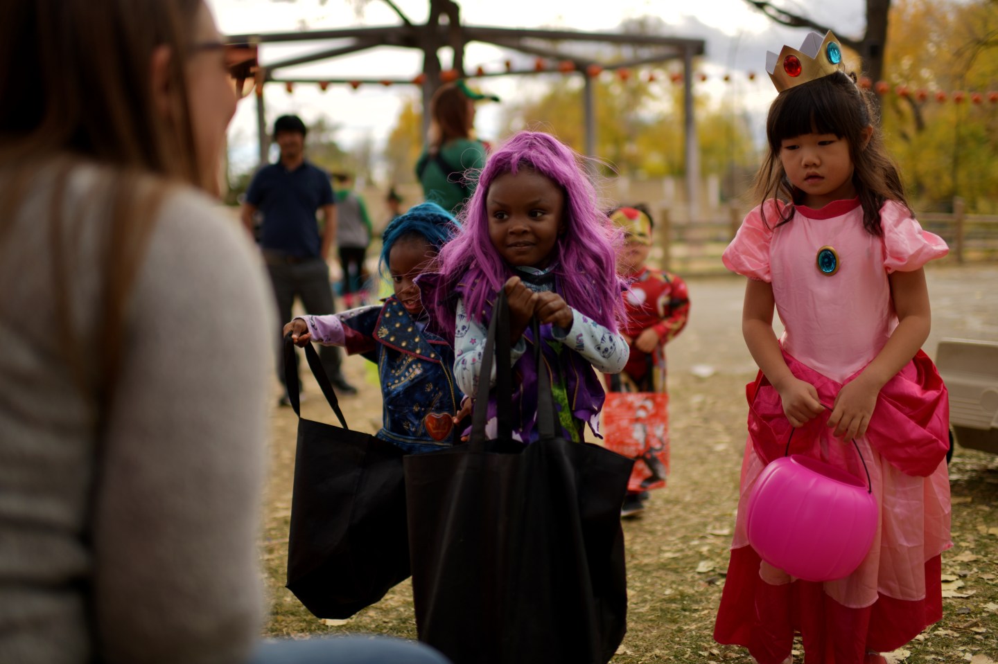 Three children go trick-or-treating