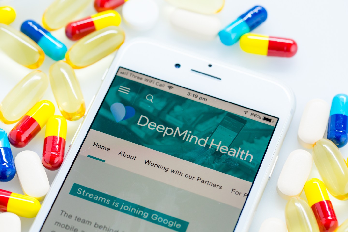 A Deepmind Health webpage sits displayed on the screen of an Apple Inc. iPhone in this arranged photograph in London, U.K. on Monday, Nov. 26, 2018. Three years ago, artificial intelligence company DeepMind Technologies Ltd. embarked on a landmark effort to transform health care in the U.K. Now plans by owner Alphabet Inc. to wrap the partnership into its Google search engine business are tripping alarm bells about privacy.