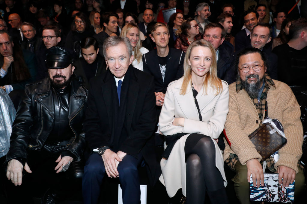 PARIS, FRANCE - JANUARY 18: (L-R) Peter Marino, Owner of LVMH Luxury Group Bernard Arnault, Louis Vuitton's executive vice president Delphine Arnault and Takashi Murakami attend the Dior Homme Menswear Fall/Winter 2019-2020 show as part of Paris Fashion Week on January 18, 2019 in Paris, France. (Photo by Bertrand Rindoff Petroff/Getty Images)