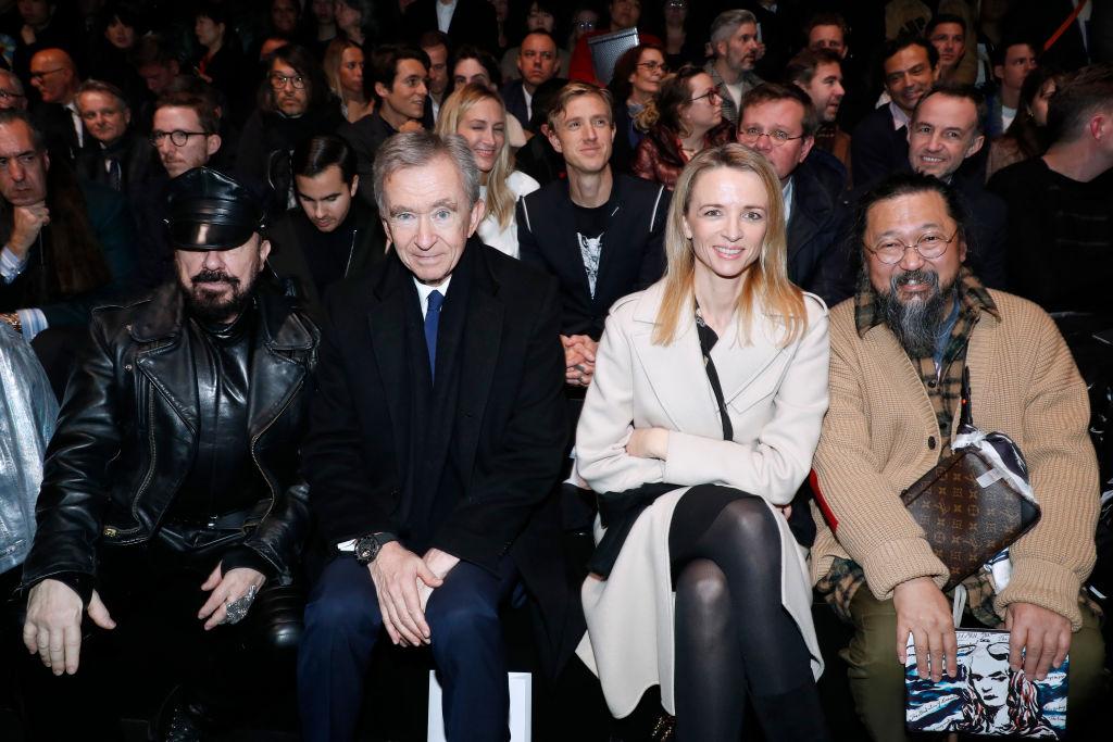 PARIS, FRANCE - JANUARY 18: (L-R) Peter Marino, Owner of LVMH Luxury Group Bernard Arnault, Louis Vuitton's executive vice president Delphine Arnault and Takashi Murakami attend the Dior Homme Menswear Fall/Winter 2019-2020 show as part of Paris Fashion Week on January 18, 2019 in Paris, France. (Photo by Bertrand Rindoff Petroff/Getty Images)
