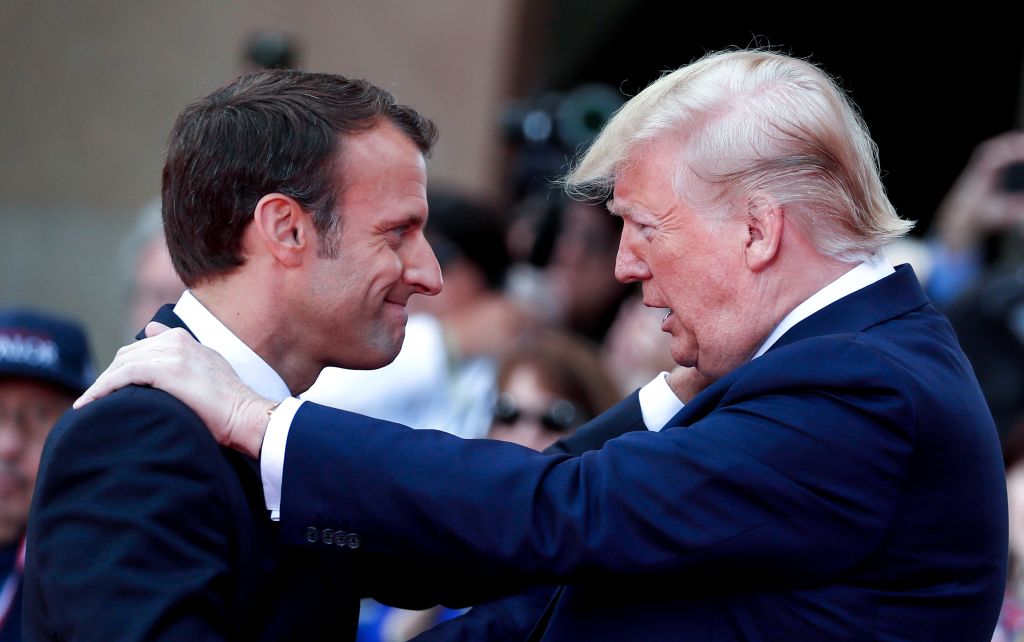 Emmanuel Macron greets Donald Trump