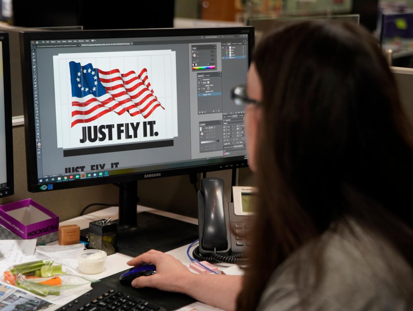 A worker designs a Just Fly It t-shirt with the Betsy Ross flag at Colonial Flag on July 5, 2019 in Salt Lake City, Utah.