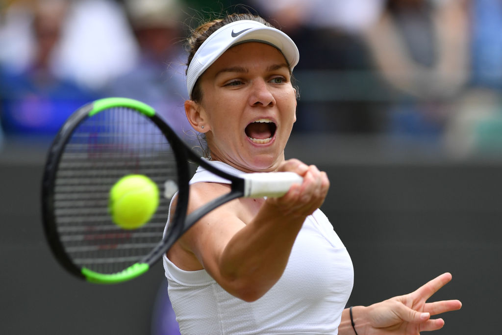 Simona Halep returns a shot in her quarter-final match against Shuai Zhang