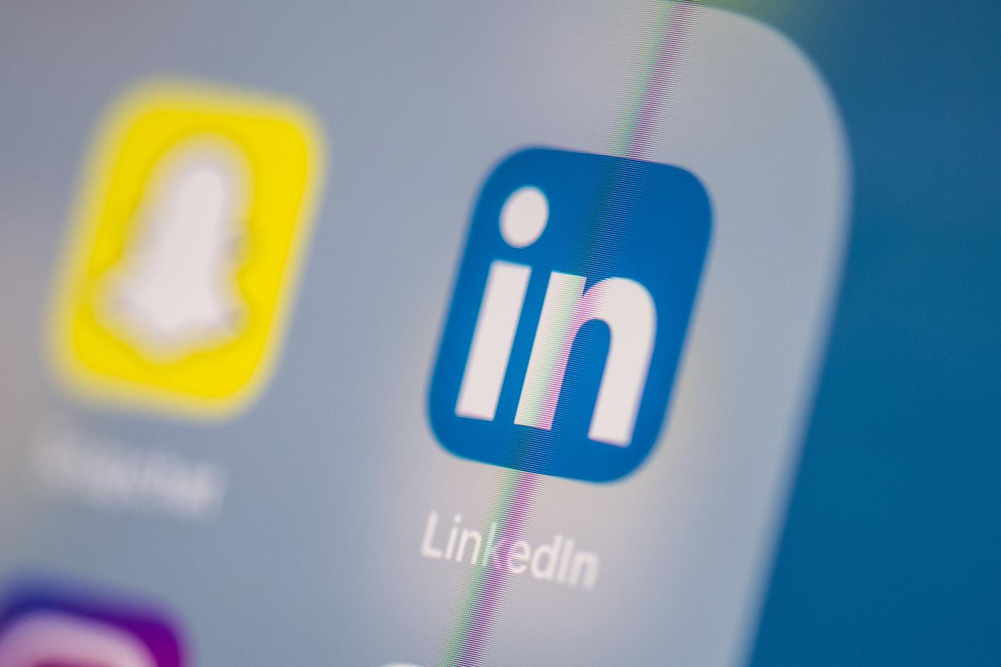 This illustration picture taken on July 24, 2019 in Paris shows the logo of the US social network application Linkedin on the screen of a tablet.